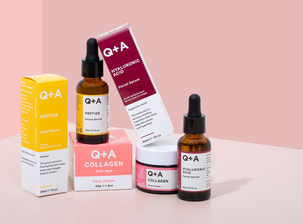 Beauty and skincare products from Q+A brand displayed on pink background with minimal packaging design.