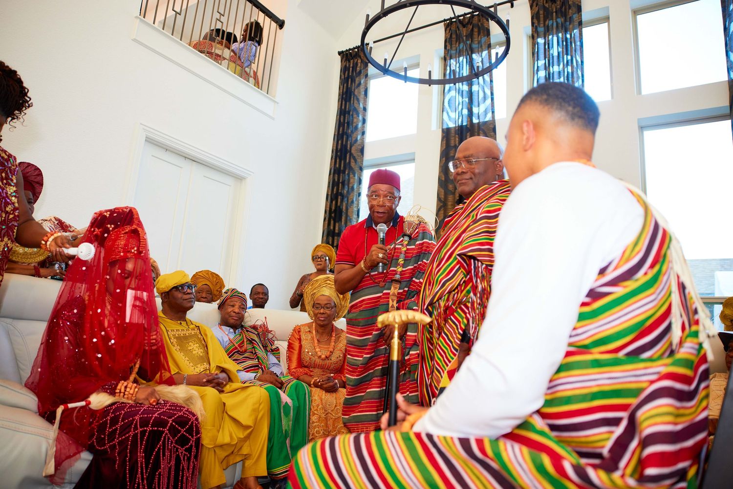 Traditional Buddhist monks in colorful ceremonial robes participate in a spiritual gathering and meditation ceremony.