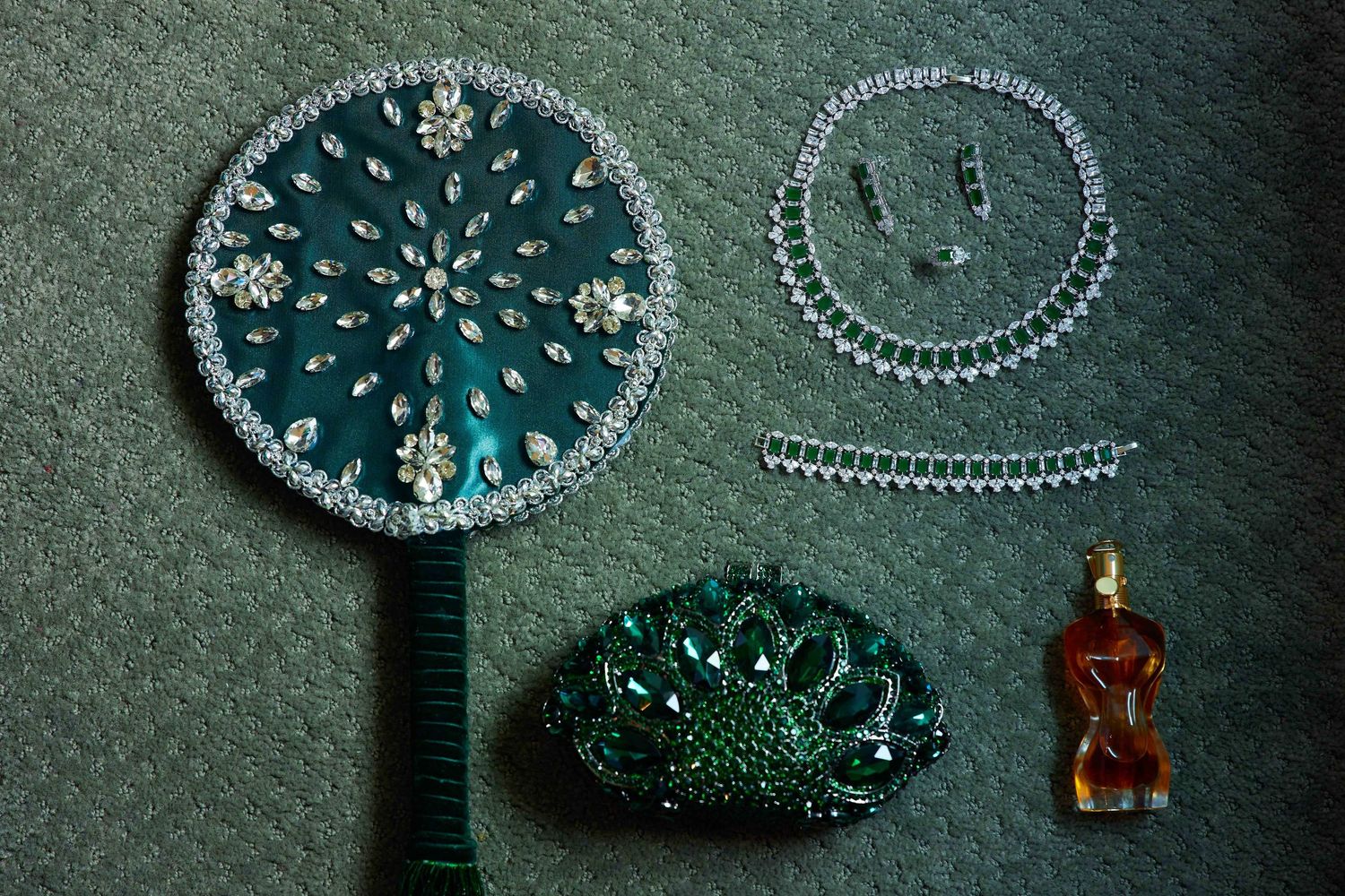 Hand-beaded turquoise coasters made with intricate circular patterns and beadwork embellishments on green fabric.