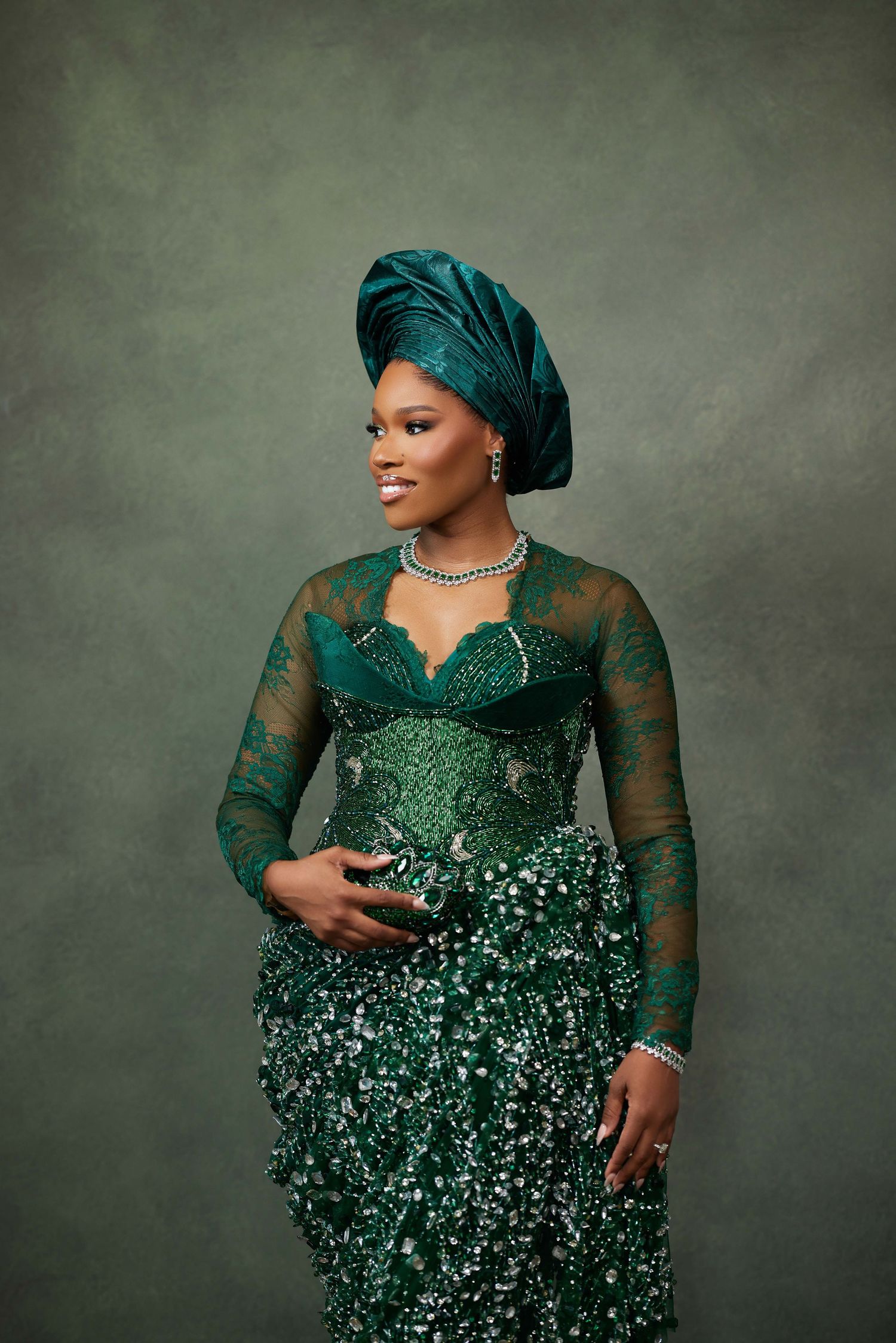 A series of formal portraits showing someone in an elegant emerald green sequined gown and head wrap against a grey background.
