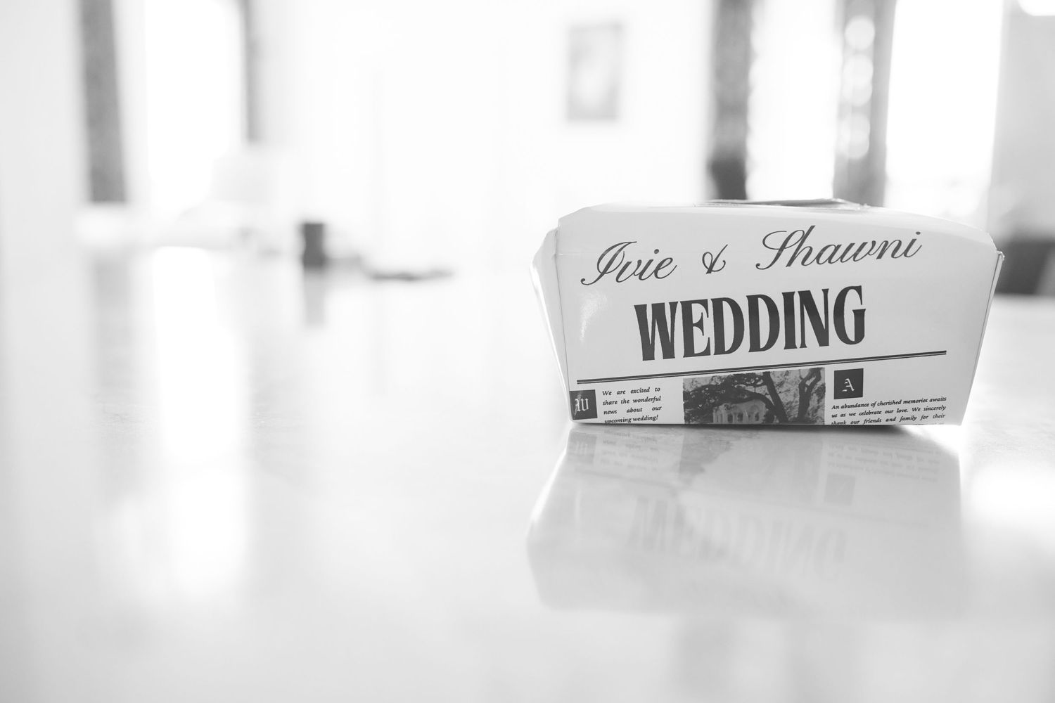 White wedding sign displayed as part of an elegant event setup with soft focus and gentle lighting.
