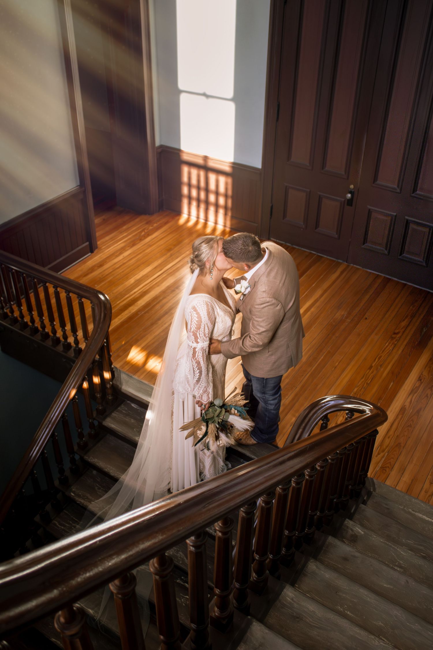 Couple laughing and gazing into each other’s eyes, full of joy and connection during their engagement session.
