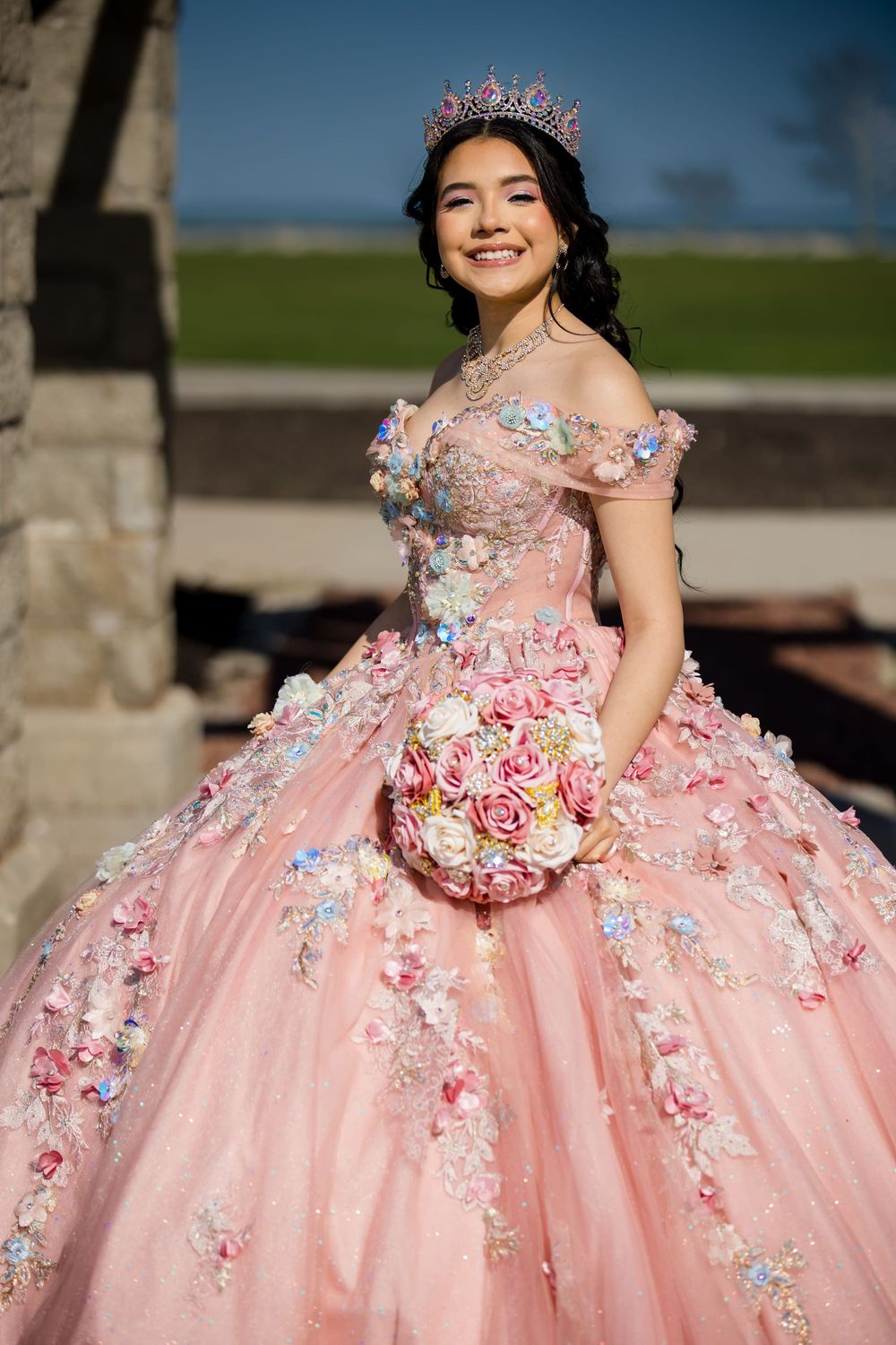 Quinceañera in a pink gown with floral details. Professional XV portrait photography in Lake County by Alex T Photography.