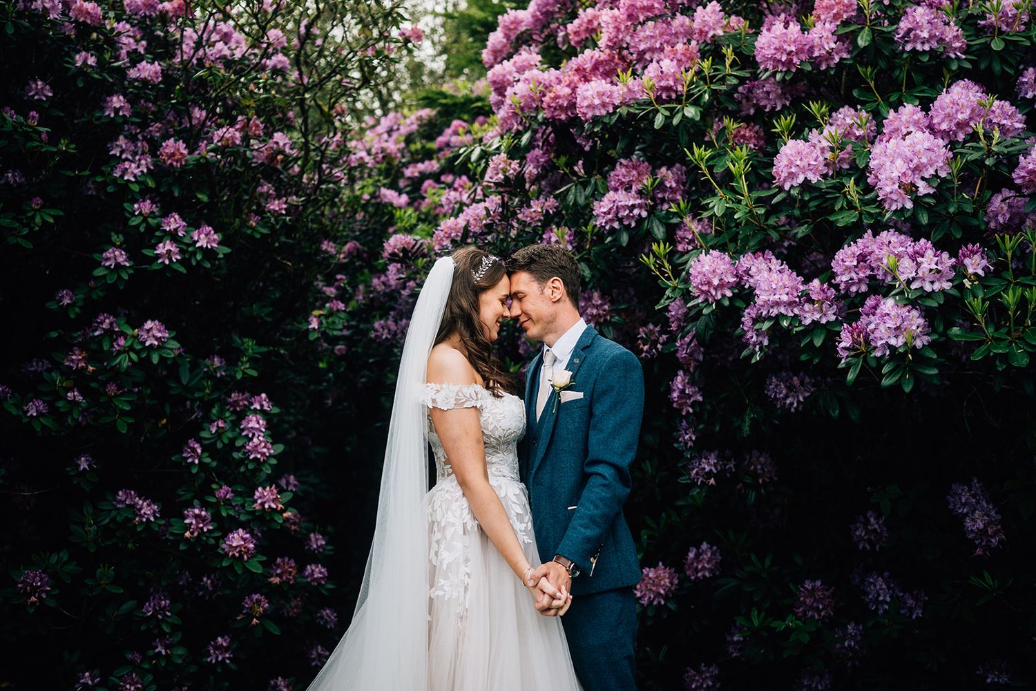 A romantic garden scene with blooming pink flowers creating a stunning floral backdrop.