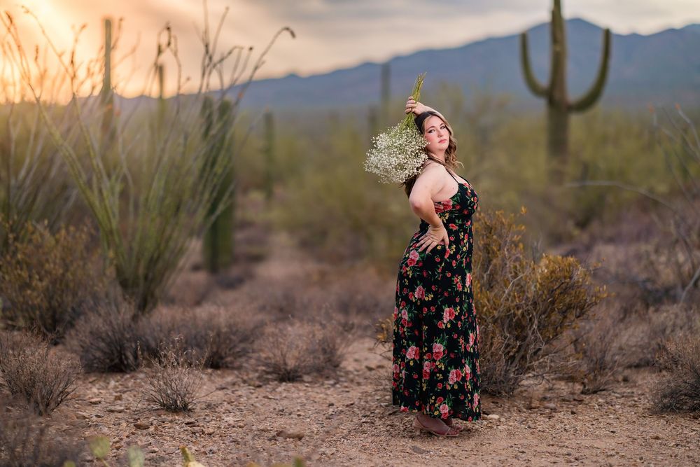 Unique senior pictures with flowers in the desert and stormy skies- Tucson Senior Photographer