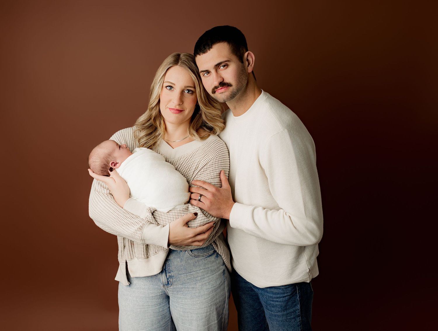 Bailey's Photography | Scioto County | Studio Family Photography | Parents Snuggling Newborn