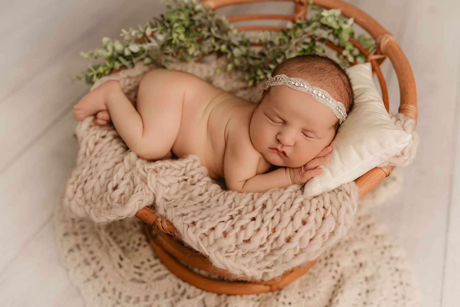 Bailey's Photography | Greenup KY | Newborn Posing Studio | Baby Girl with Headband on Neutral Blanket