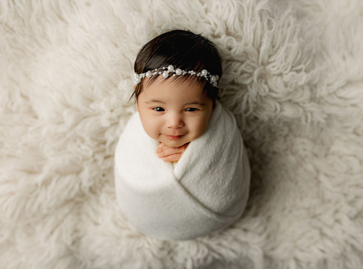 Bailey's Photography | Newborn Photos | Beaver OH | Baby in White Swaddle on Cream Blanket