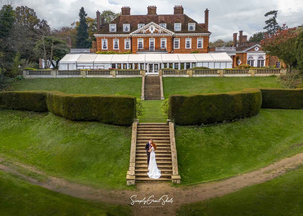 Bride and groom sharing a quiet intimate moment on the stairs that lead to their wedding venue.