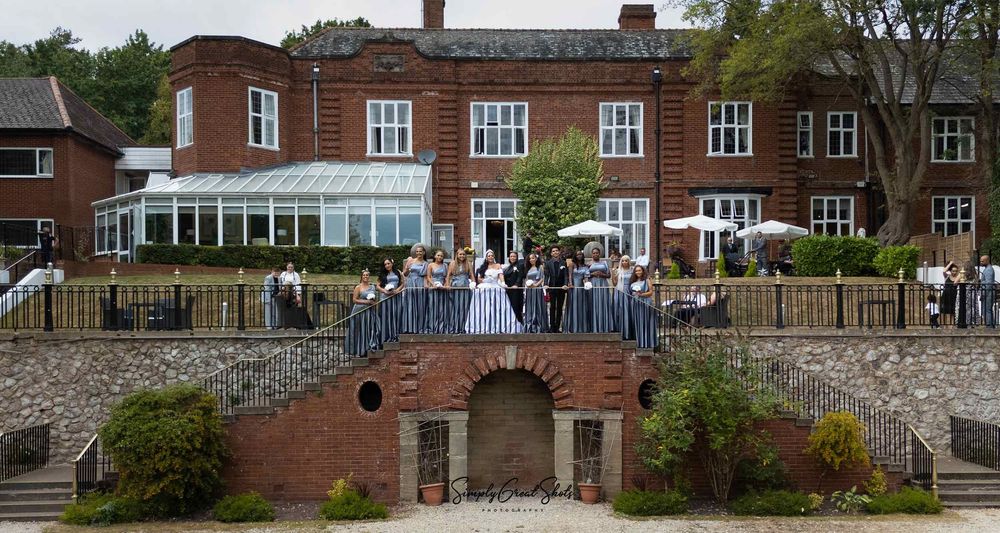 Southcreat Manor Wedding Photographer uses a drone to capture the bridal party in the rear garden.