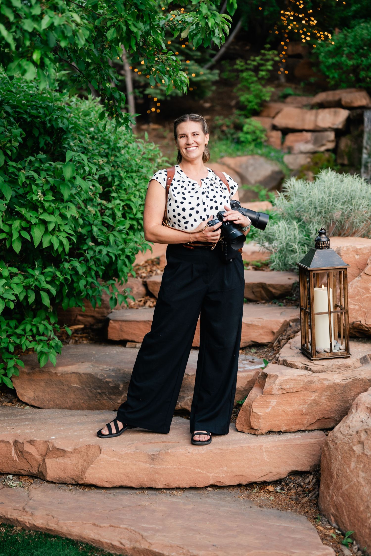 A series of outdoor portrait photographs taken on red rock steps with lanterns and greenery in the garden setting.
