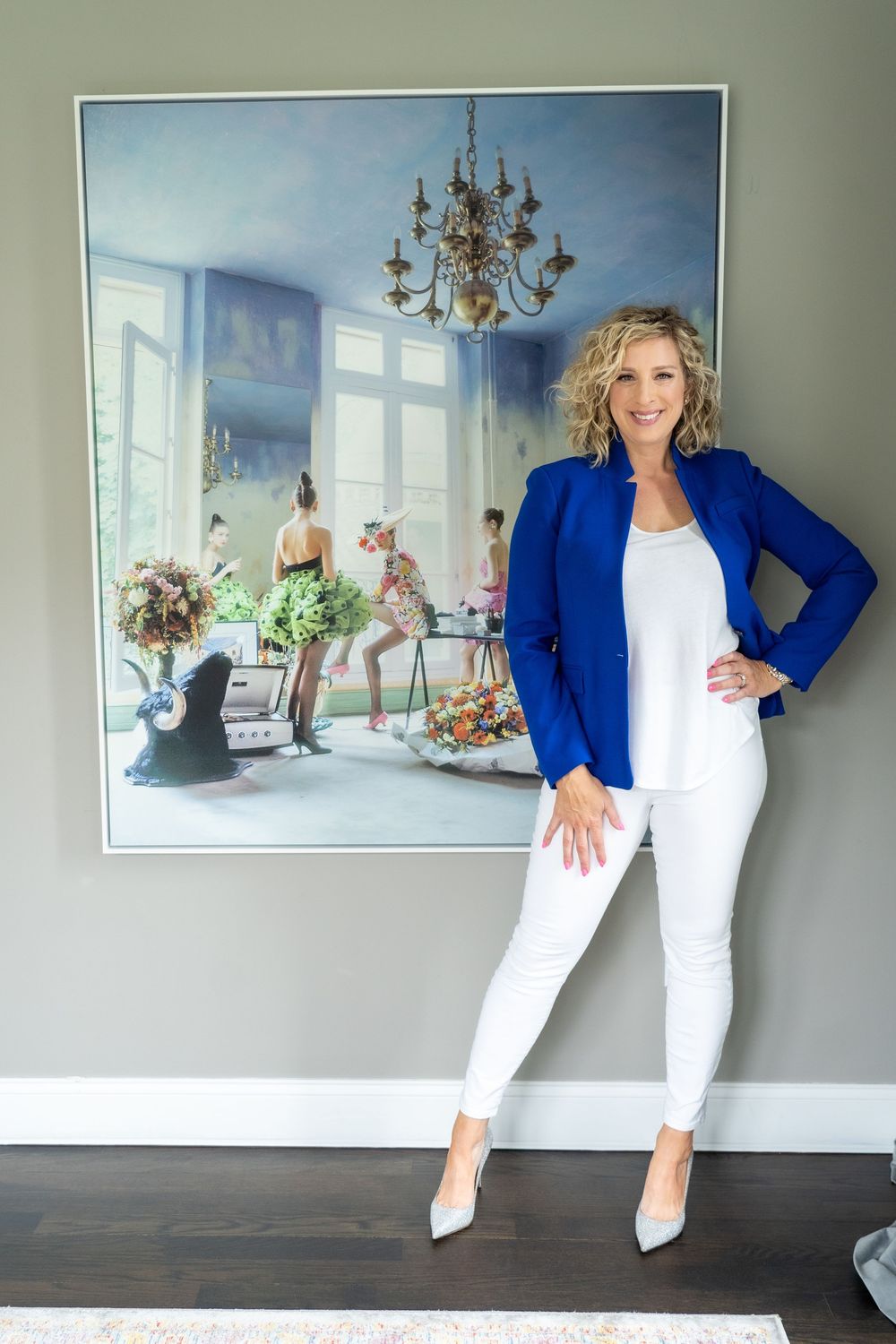 Stylish outfit combination of navy blazer with white pants in contemporary home setting.