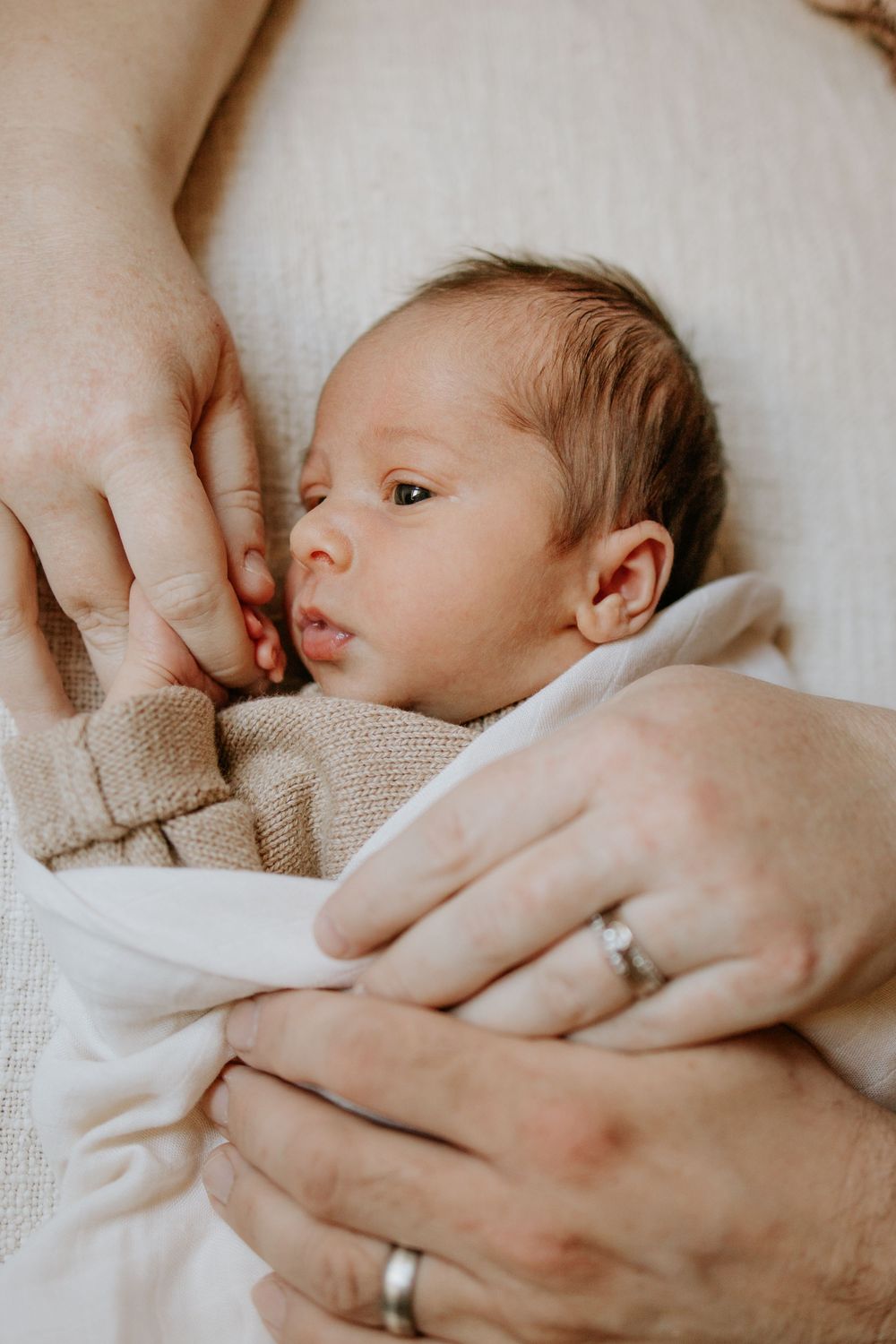 Relaxed in-home newborn photoshoot with natural poses in Adelaide