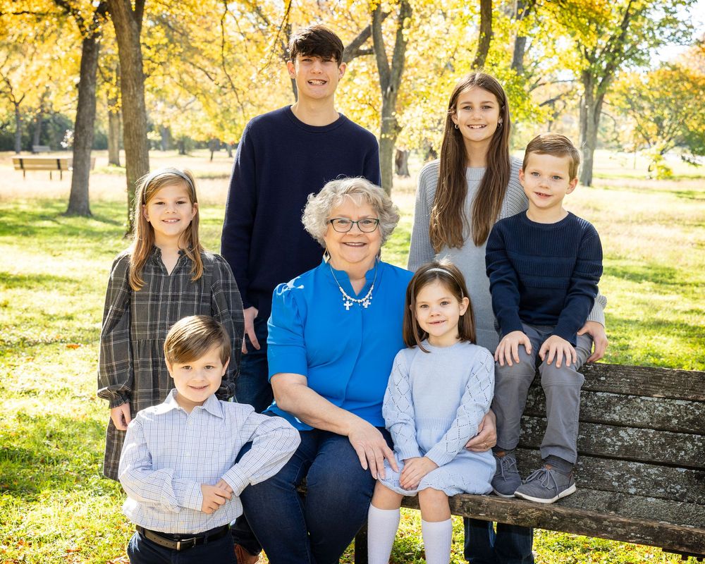 Grandmother and her grand children on a park bench