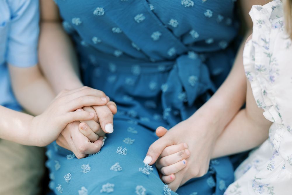 Series of intimate candid poses showing affectionate interaction between two people wearing coordinating blue outfits.