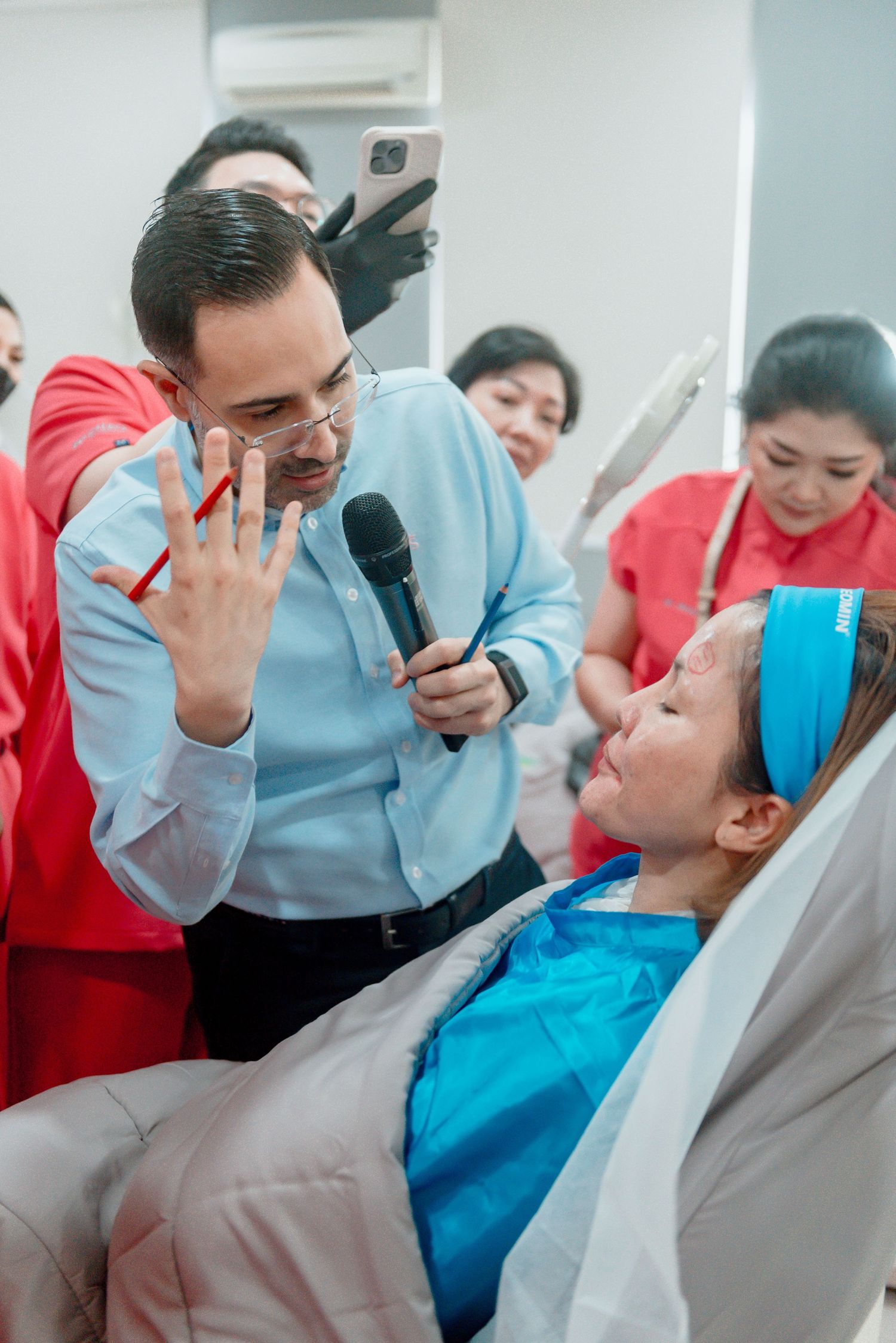 A series of candid photos showing people in red and blue outfits laughing together during a group activity.