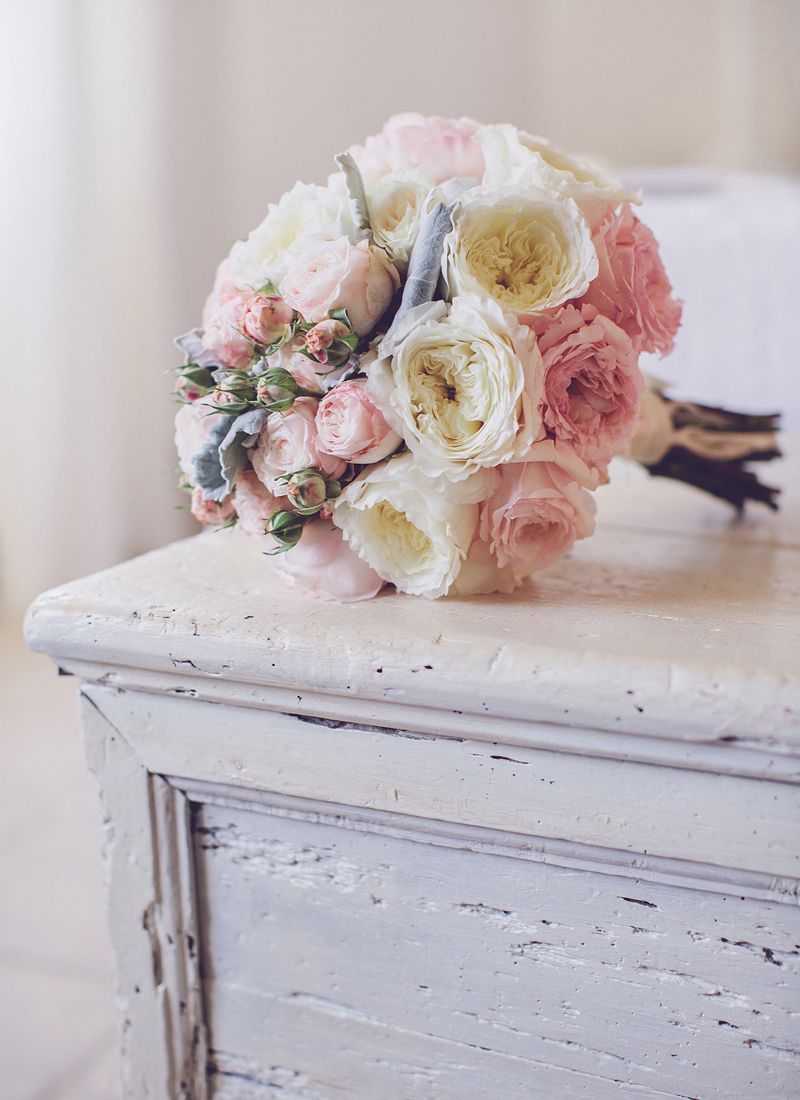 Romantic wedding bouquet with white and blush roses.