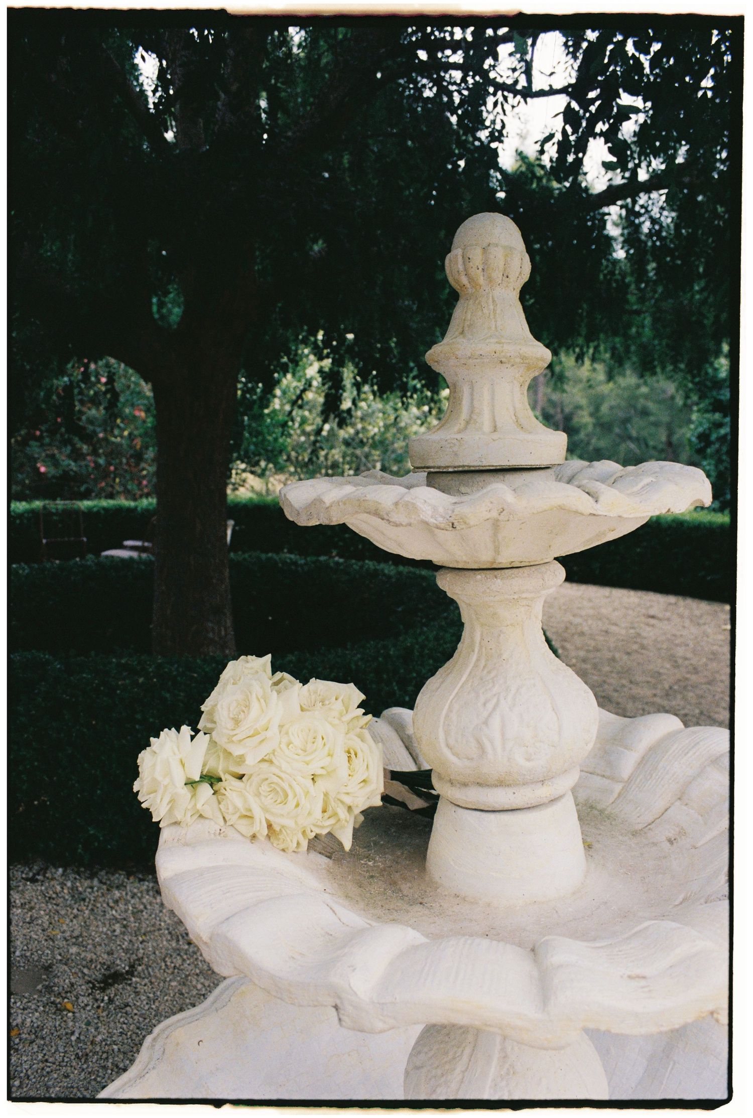 White table settings with elegant gold accents and candles create an intimate dining atmosphere at dusk.