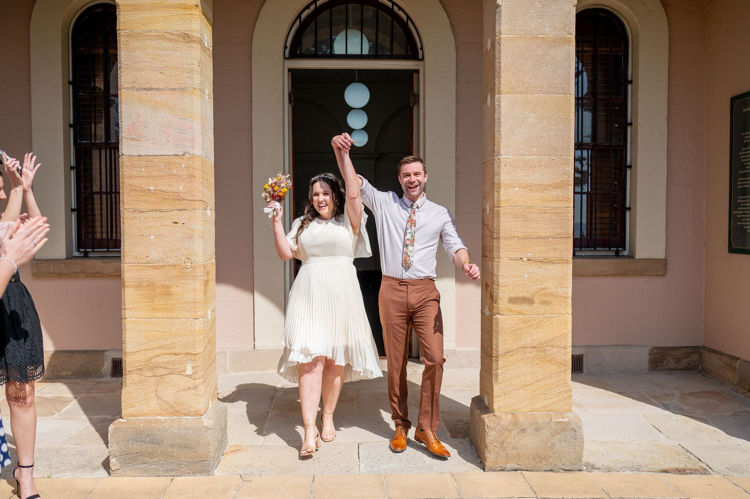 Collage of wedding celebration photos showing joyful moments under arched stone architecture.