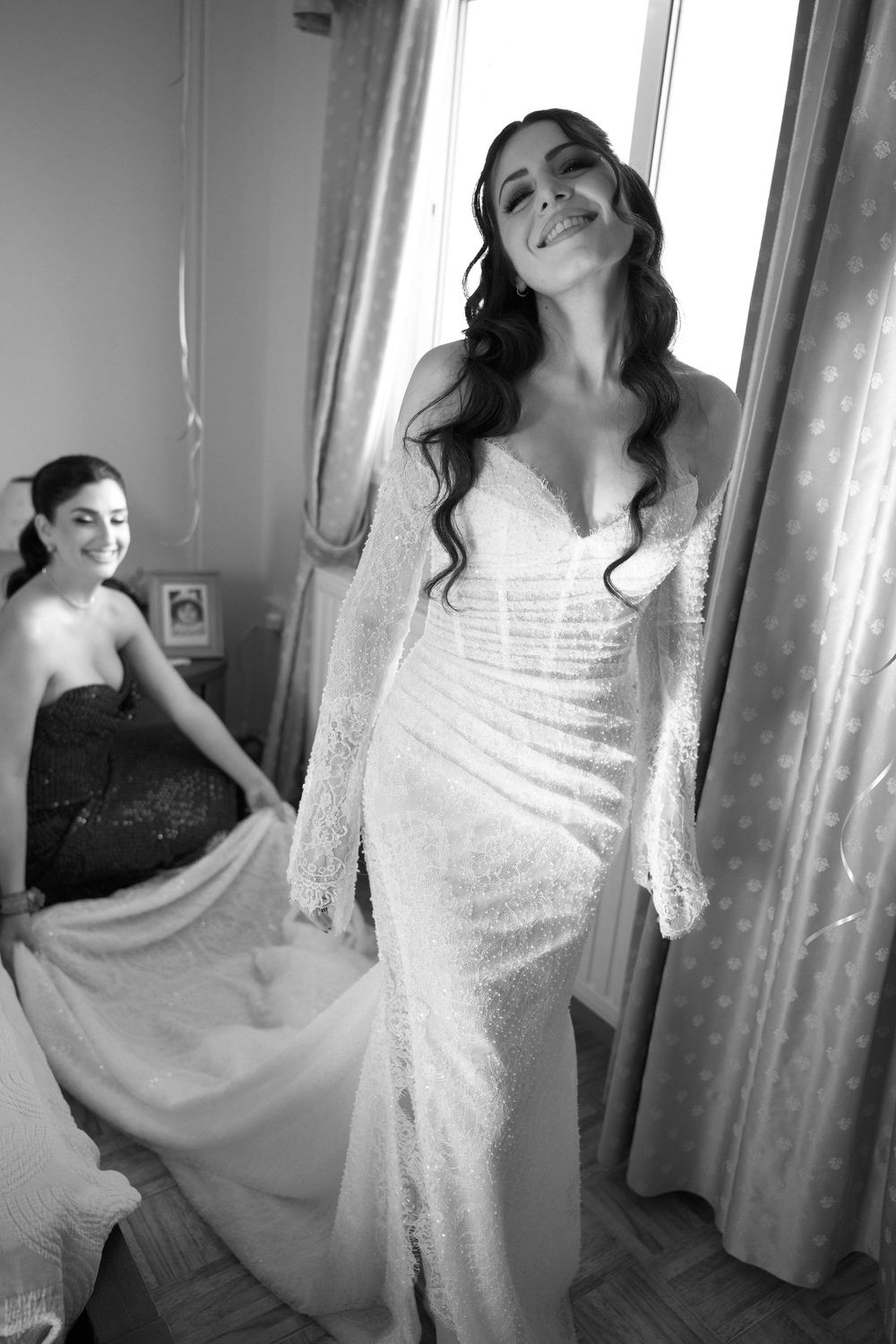 A series of black and white artistic portraits showing a woman in a white dress posing gracefully against window light.