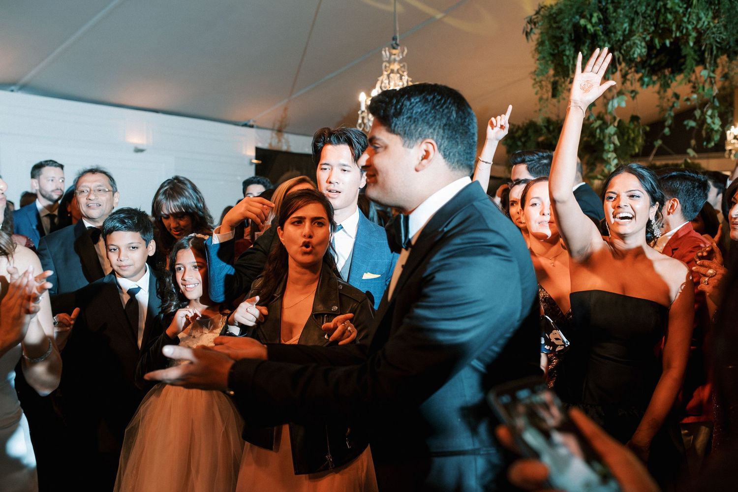 Guests surrounding the couple in an electric moment at Correio-Mor palace wedding in Lisbon