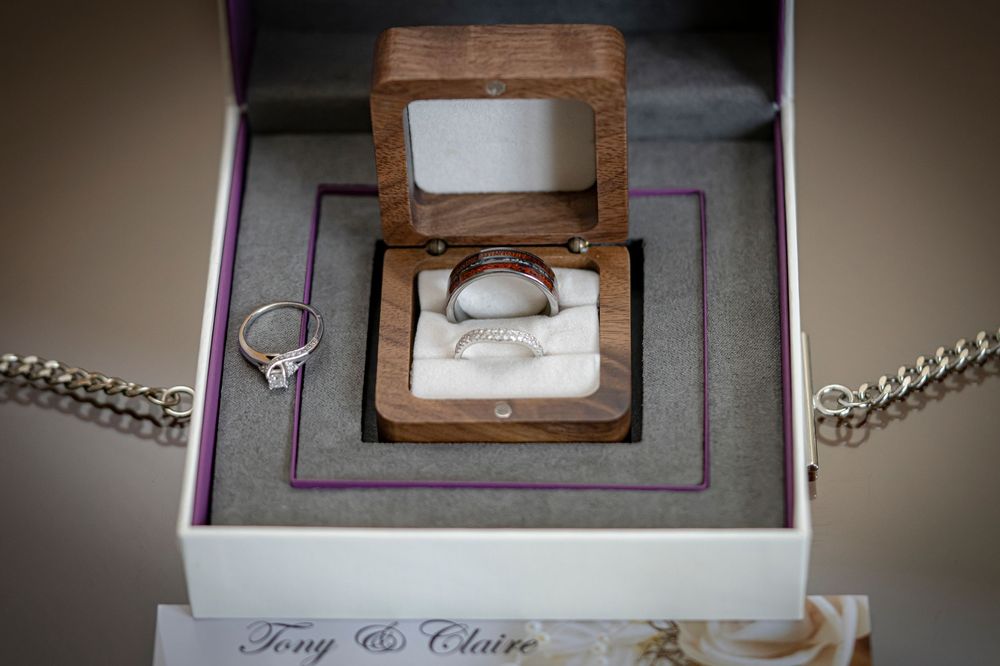 Wedding ring displayed in an elegant gray jewelry box.
