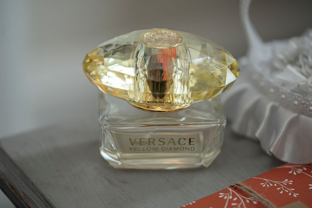 Collection of elegant perfume bottles arranged on a light surface.
