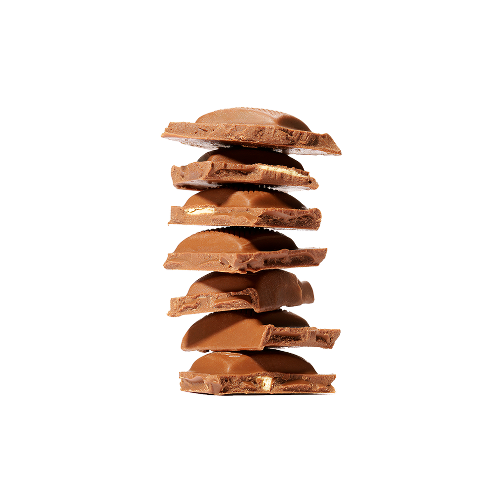 Product photography featuring stacked pieces of a chocolate bar, created by commercial photographer Chris Z of Zeng Studio.