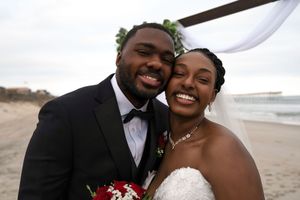 Close-up of happy couple sharing intimate moments during their beach wedding.