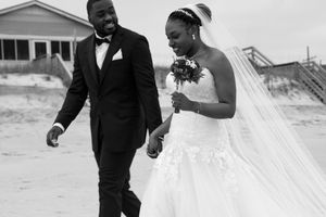 Wedding couple shares candid moments during their beach celebration.