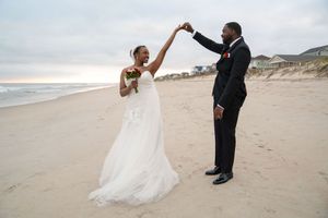 Romantic beach wedding photography session at sunset.