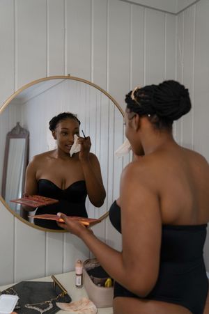 Wedding preparation scene with mirror reflections and getting ready moments.