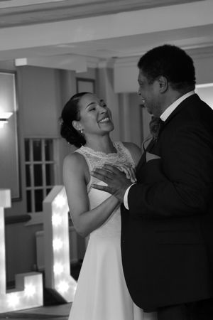 Black and white photos capture intimate dancing moments at an elegant wedding reception.