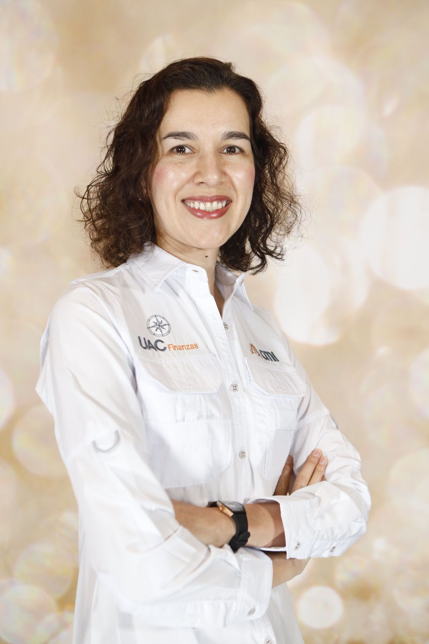 Professional wearing a crisp white chef's coat poses against a soft beige bokeh background.