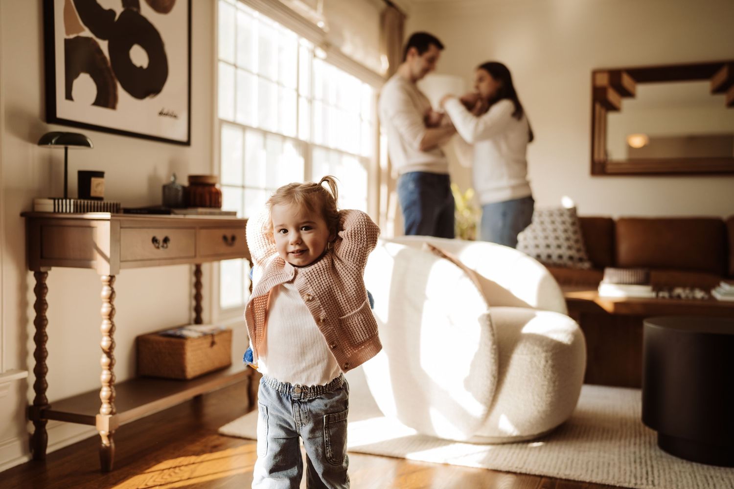 A sepia-toned photo collage shows intimate moments of family life with a vintage aesthetic and warm lighting.