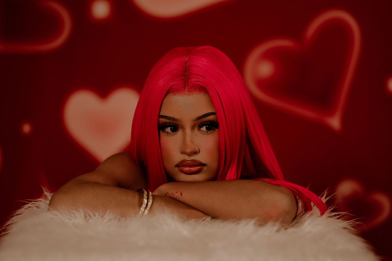 Red-themed collage of fashion photos featuring dramatic lighting and romantic heart motifs in the background.