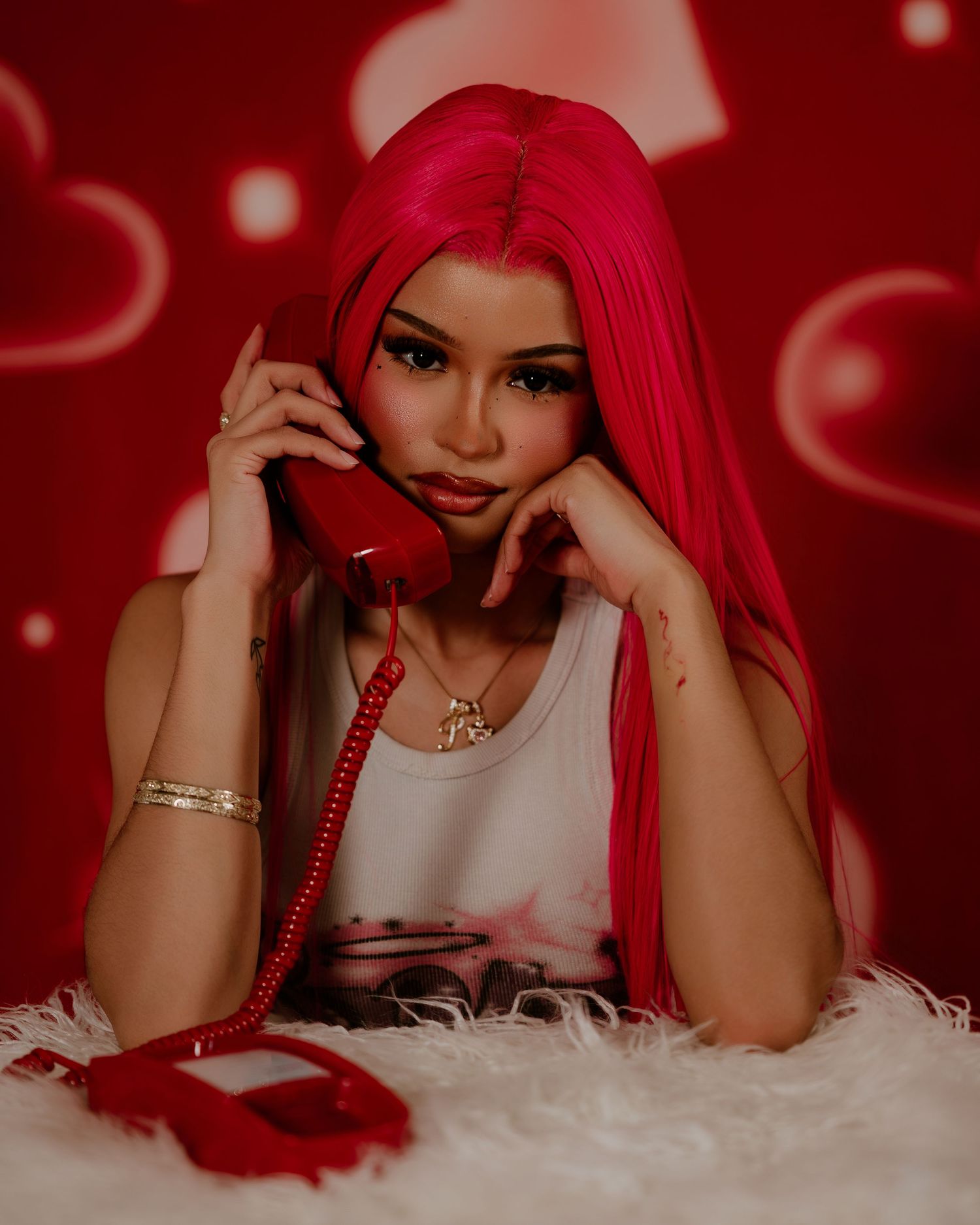 A series of photos with a red-haired figure posing playfully against a white furry backdrop with red lighting.