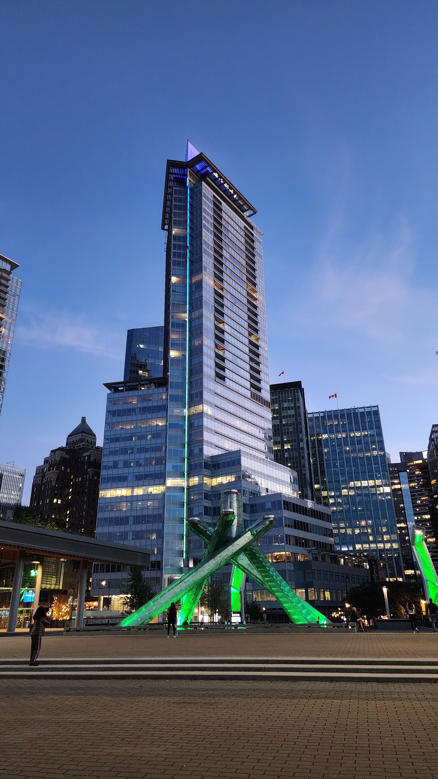 Cityscape of downtown Vancouver with modern glass buildings.