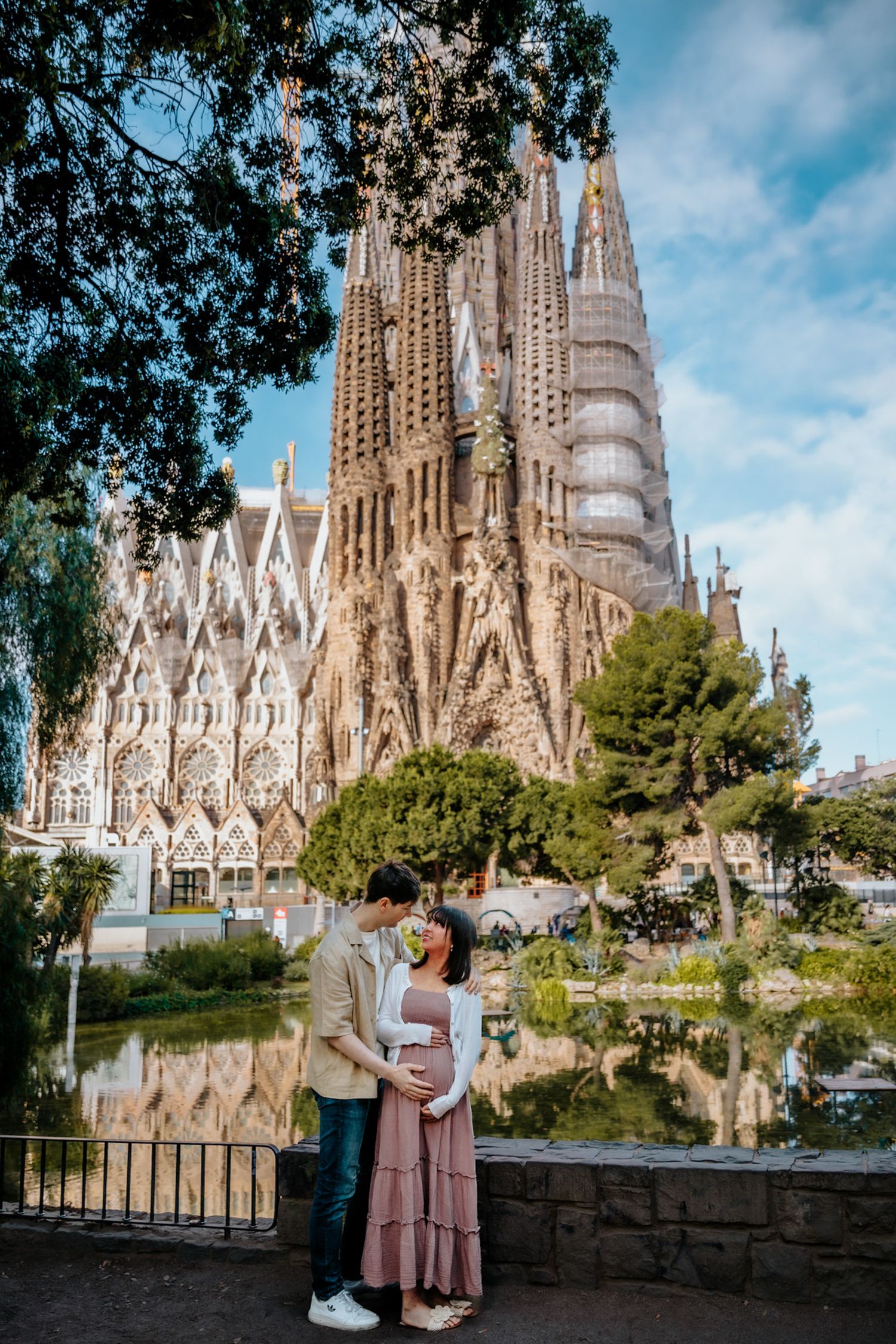 Expecting parents enjoying a sweet walk during their Barcelona maternity shoot.