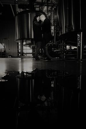 engagement photo of couple at iowa brewery