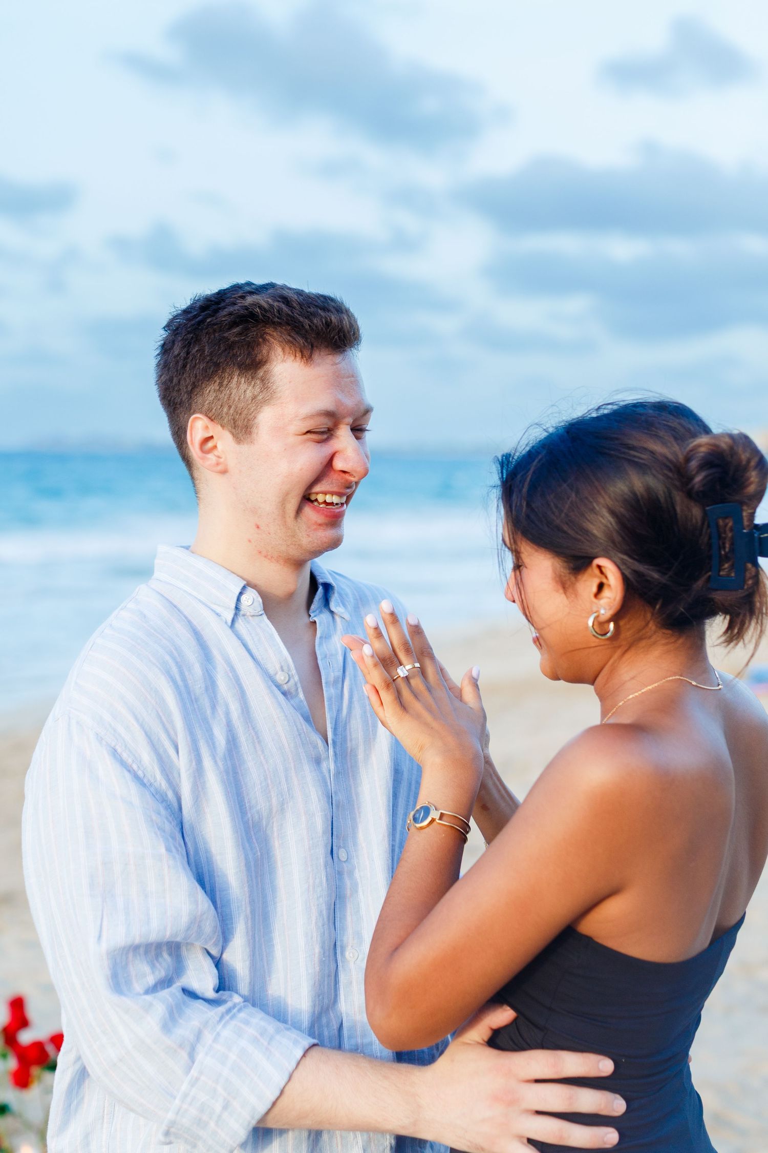 Couples portrait. Marriage proposal on the beach in Isla Verde, Carolina, Puerto Rico.