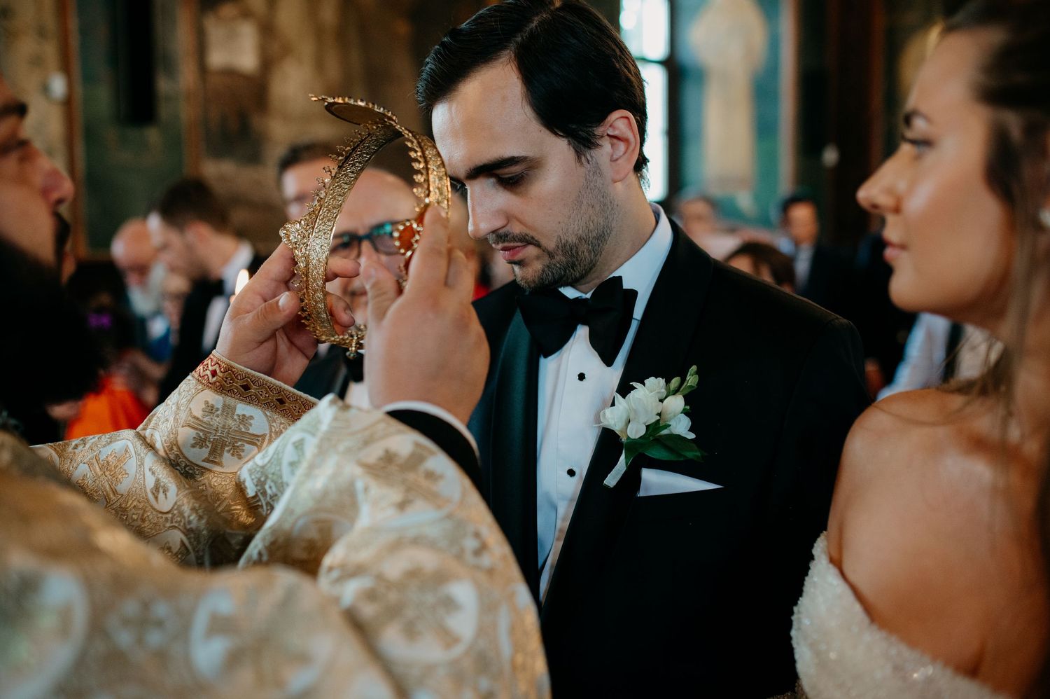 Bride and groom standing before the altar during their religious wedding ceremony