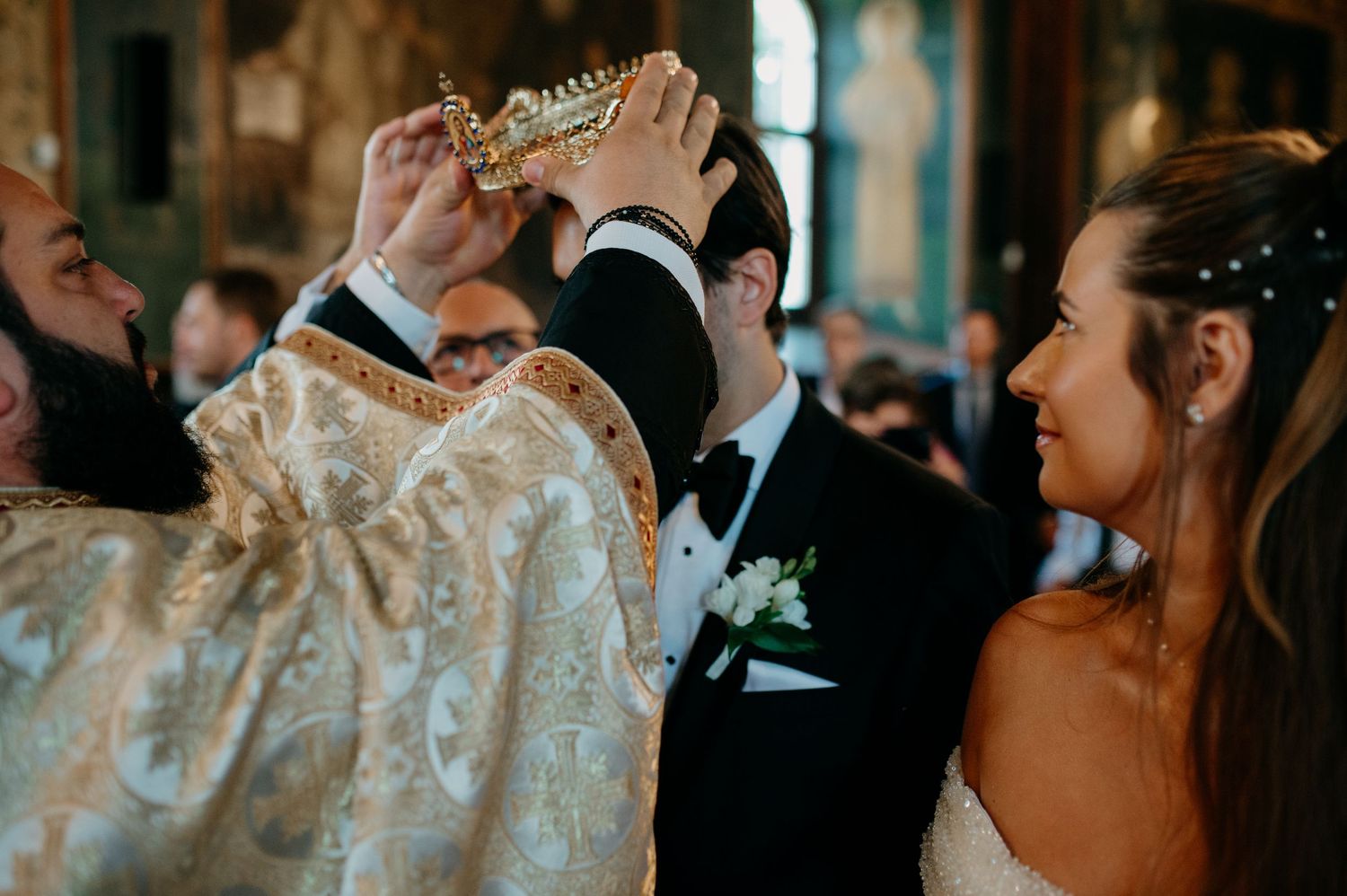 Bride and groom standing before the altar during their religious wedding ceremony