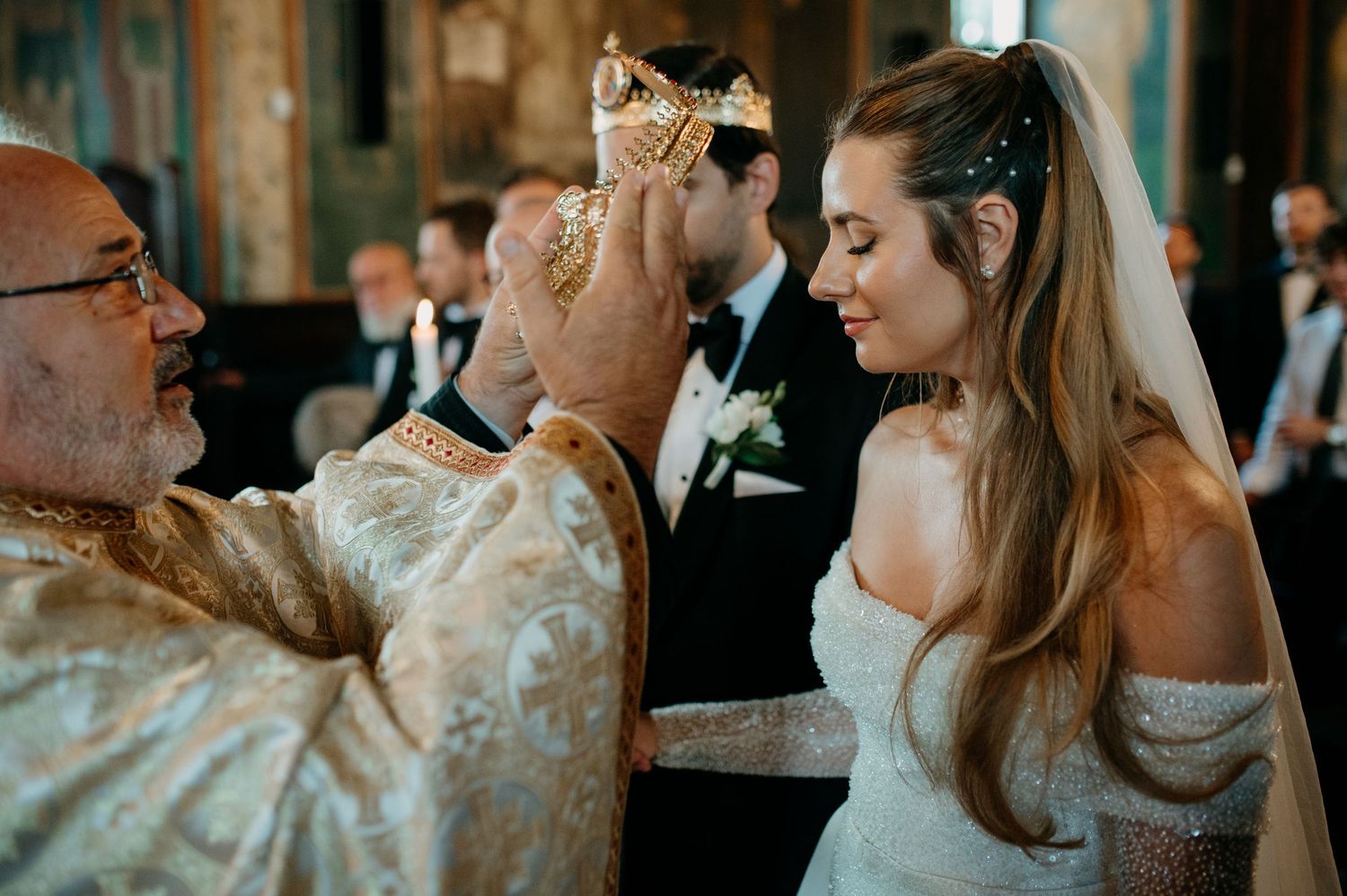 Bride and groom standing before the altar during their religious wedding ceremony
