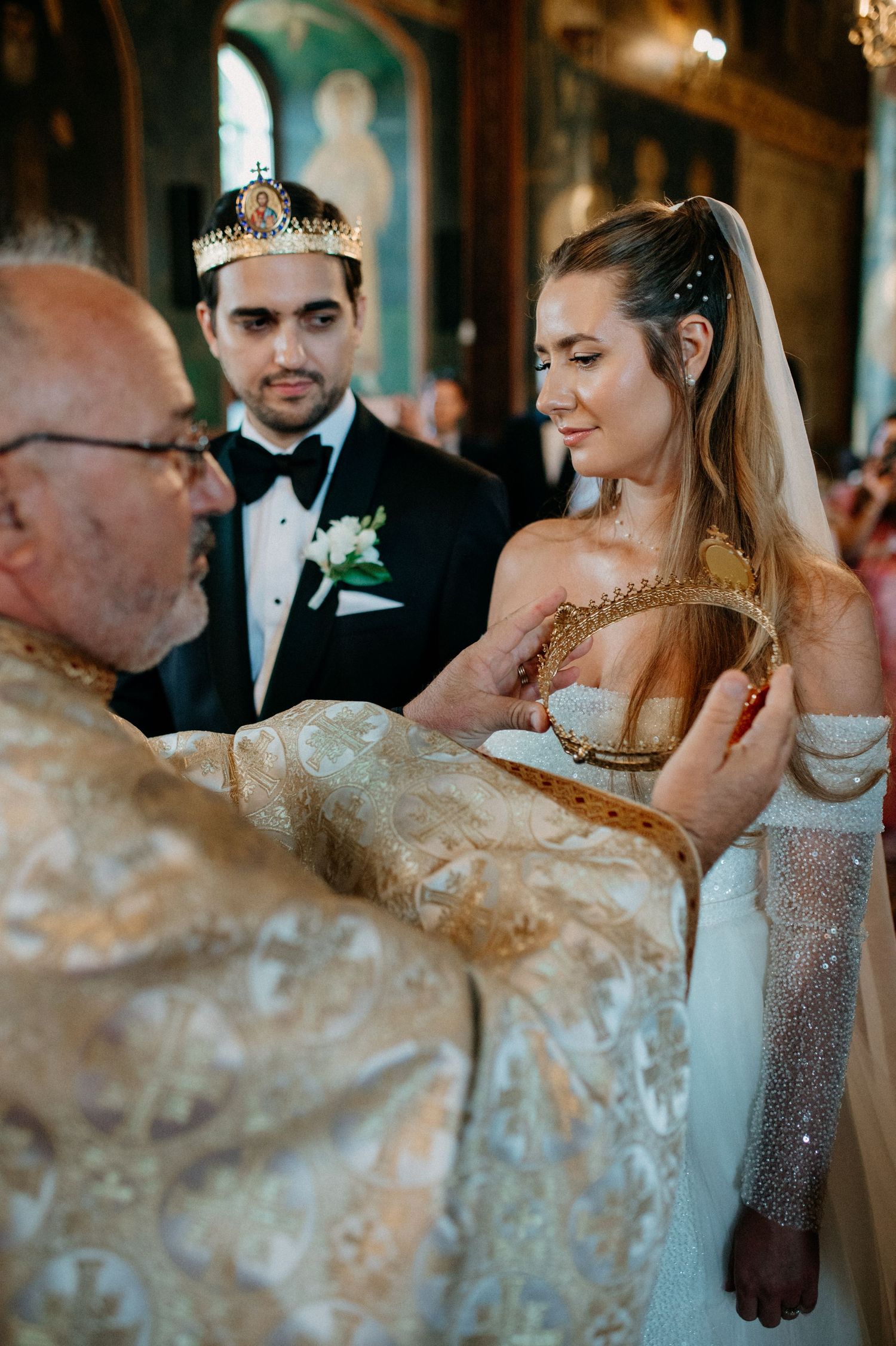 Bride and groom standing before the altar during their religious wedding ceremony
