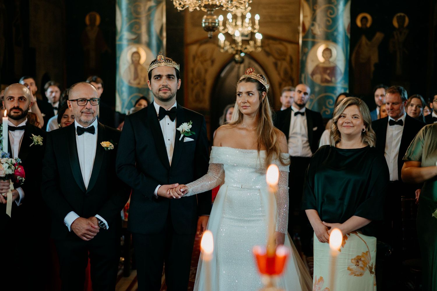Portrait of a bride and groom standing during religious ceremony.
