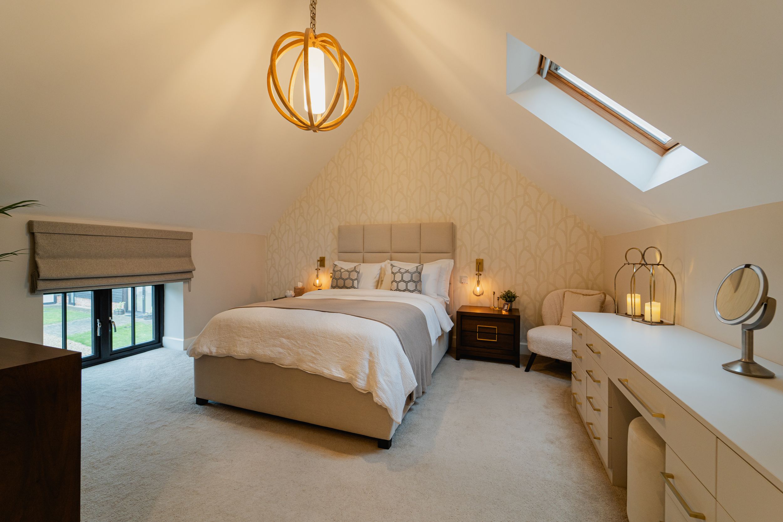 A modern white bedroom interior with skylight window, wood floors, and minimal contemporary furnishings.
