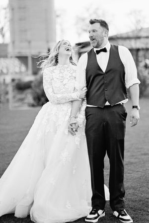 A black and white photograph of a happy couple during outdoor wedding portraits showing multiple candid moments.