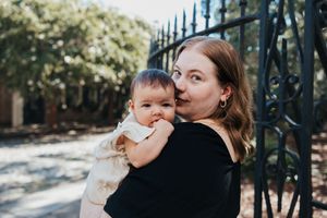 A tender collection of six black and white outdoor photos capturing intimate family moments between parent and child.