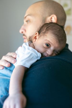 A baby rests peacefully on someone's shoulder in a series of tender moments captured from different angles.
